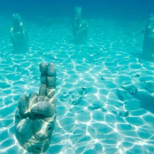 hands underwater punta sam sculptures 300x300